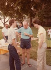 Three members standing in front of snack table at the Dignity/Central PA Great South Lawn Picnic – Summer 1983