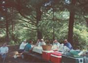 Group members at table during the Dignity/Central PA 20th Anniversary Picnic - July 1995