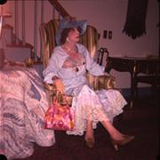 Wesley in White Dress in Striped Chair, photo 1 - July 1978