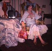 Wesley in White Dress in Striped Chair, photo 1 - July 1978