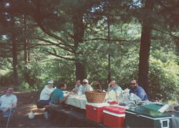 Group members at table during the Dignity/Central PA 20th Anniversary Picnic - July 1995
