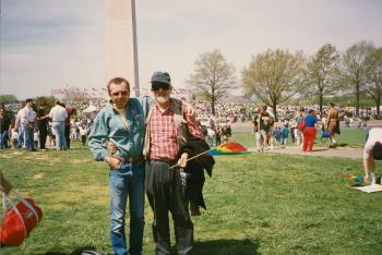 Richard Hause with person holding rainbow flag at event in Washington, D.C. - circa 1990