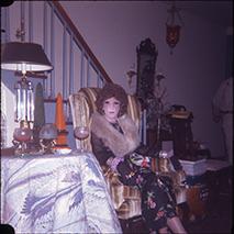Wesley in a Black Floral Dress on Striped Chair - December 1976
