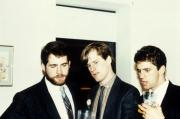 Three guys stand puzzled, c.1985