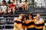 Four students sit in the bleachers, c.1985