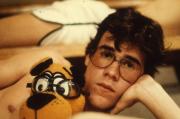Student poses with stuffed animal, c.1985
