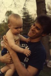 Student holds a baby, c.1985