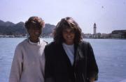 Students abroad smile in front of water, c.1986