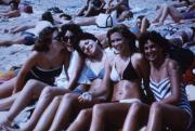 Friends lounge on beach, c.1986