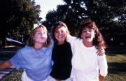 Three friends smile for the camera, c.1990