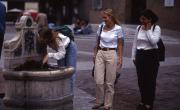 Student drinks from a fountain in Piazza Maggiore, 1994