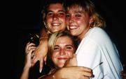 Three friends hug, c.1995