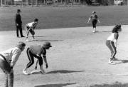 Softball players prepare for a play, 1989