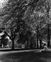 Student sitting on Morgan field, c.1980