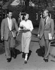 Three international students walking together, c.1955