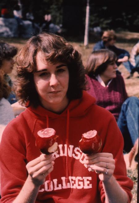 Student with two candy apples, c.1983