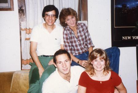 Four friends smile, c.1984