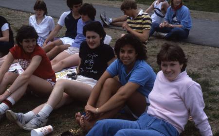 Students sit in the grass, c.1984