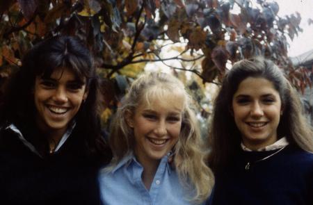 Three students pose for a picture, c.1985
