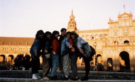 Students stand on a fountain in a square, c.1990