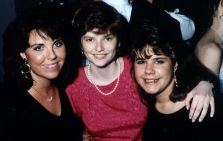Three girls smile at an event, c.1991