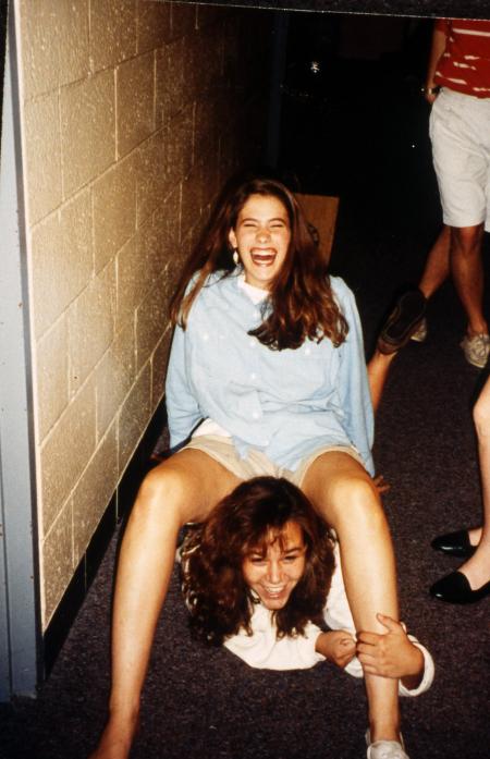 Two students laugh in their dorm hallway, c.1995
