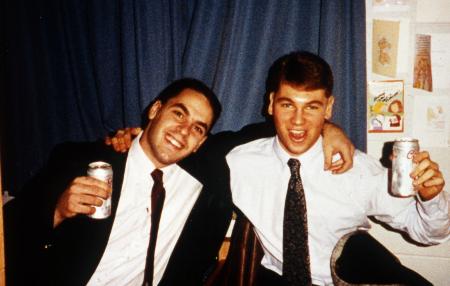 Two men in formal attire make a toast, c.1995