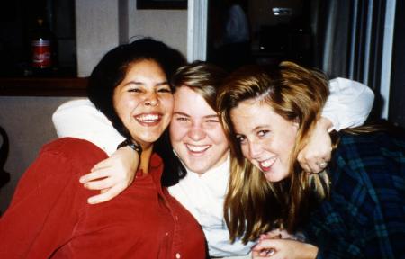 Three students hug, c.1995