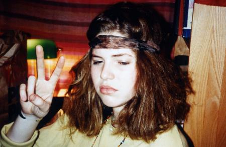 Student makes the peace-sign, c.1995