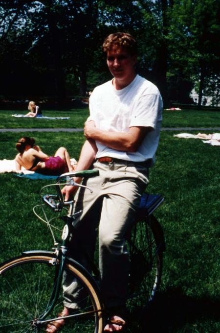 Student rides a bike, c.1995