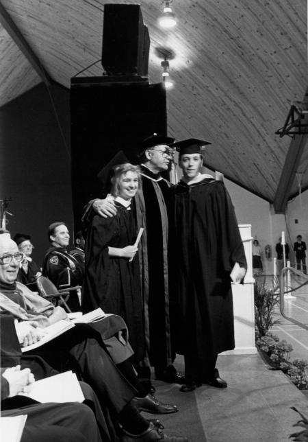 President Fritschler with two students at Commencement, 1990