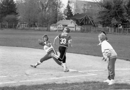 Softball player runs to the base, 1989