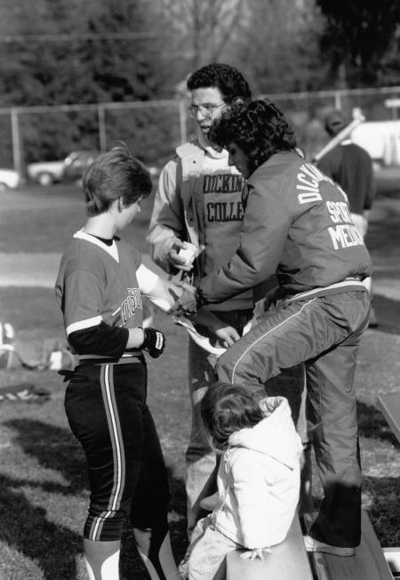 Softball player receives first aid, 1989