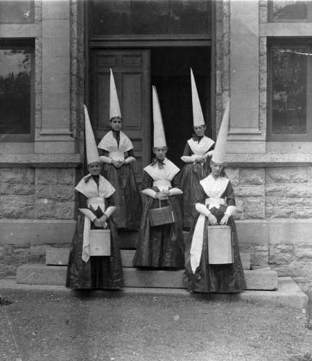 Female students in dunce caps, c.1890