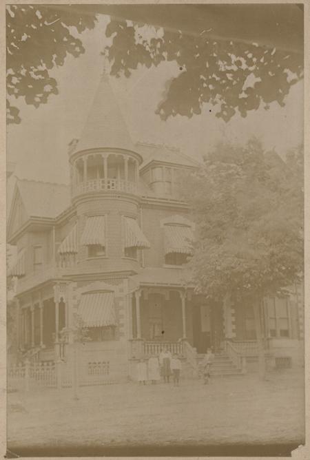 Group in front of house, c.1895