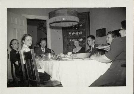 Morgan family at dining room table, c.1930