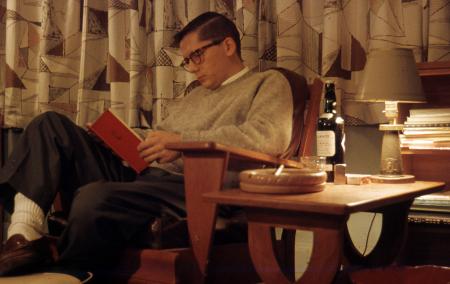 Robert Armacost reading in Beta House, 1958