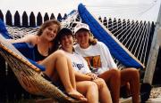 Friends sit in a hammock, c.1995
