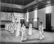 Women's physical education class with poles, 1888
