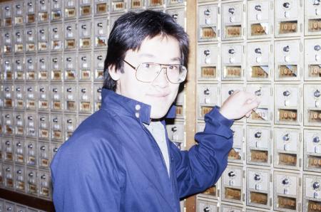 Student checks their mailbox, c.1984