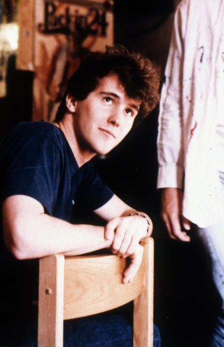 Student sits in a dorm, c.1990