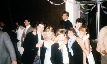 Students in formal attire pose together, c.1990