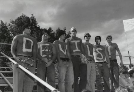 Students at Homecoming football game, 2000