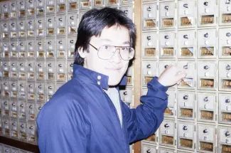 Student checks their mailbox, c.1984