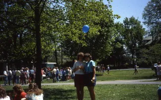 Two girls attend a picnic, c.1985