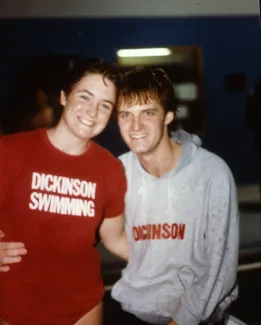 Two members of the swim team smile, c.1985