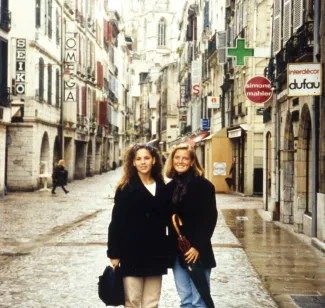 Students smile on a rainy day in France, c.1996