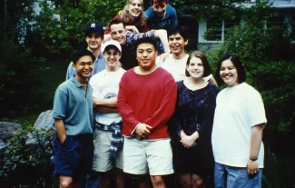 Group poses on a rock, c.1996