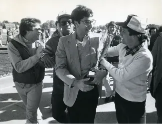 Beta Theta Pi brothers with a trophy, c.1980