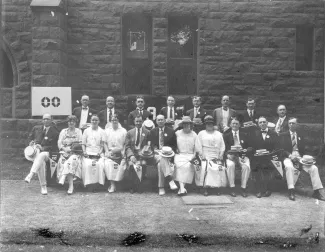 Alumni from the Class of 1900 holding pennants, 1915 